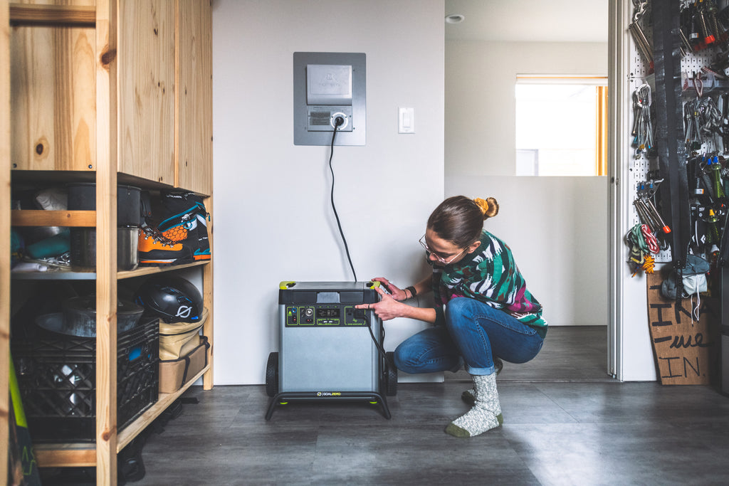 Women using the Goal Zero Yeti Portable Power Station plugged into the Home Integration Kit (HIK) for home backup purposes.