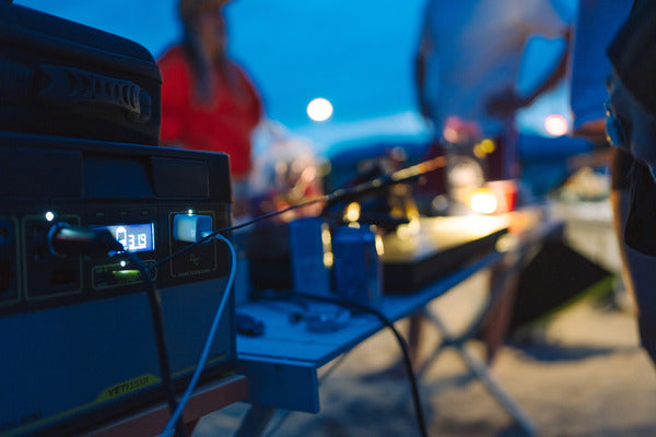 A Goal Zero power station charges devices during a camping trip. 