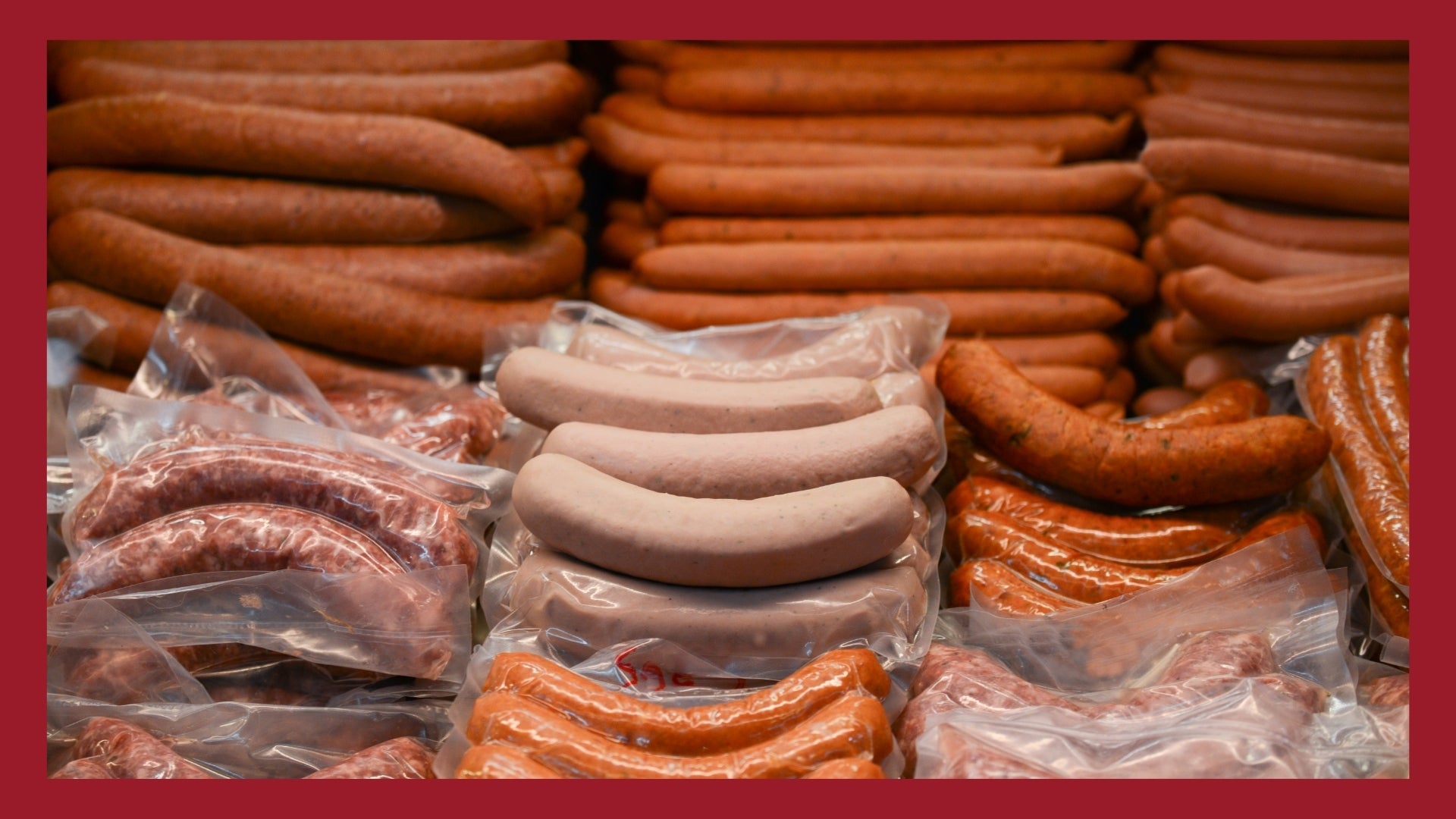 A bunch of different types of sausages in a big pile.