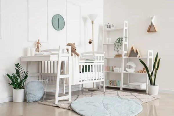 Interior of light bedroom with baby crib and floor lamp