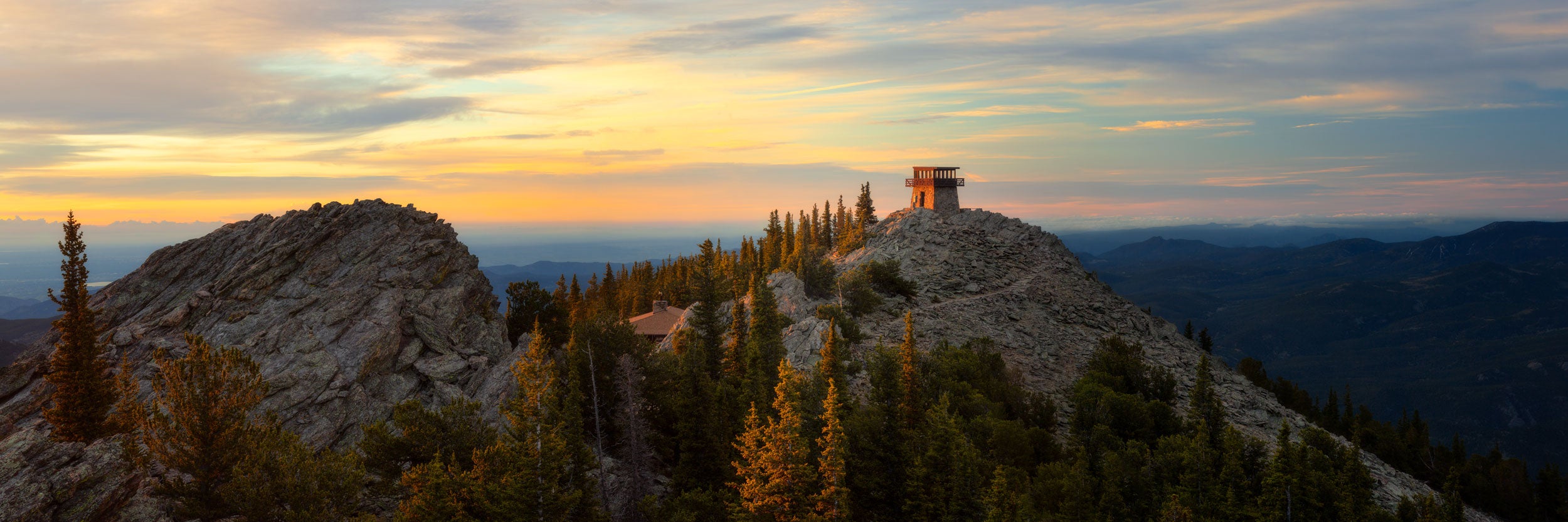 A fine art nature photograph of a fire tower lookout near Evergreen and Denver, Colorado at sunrise.