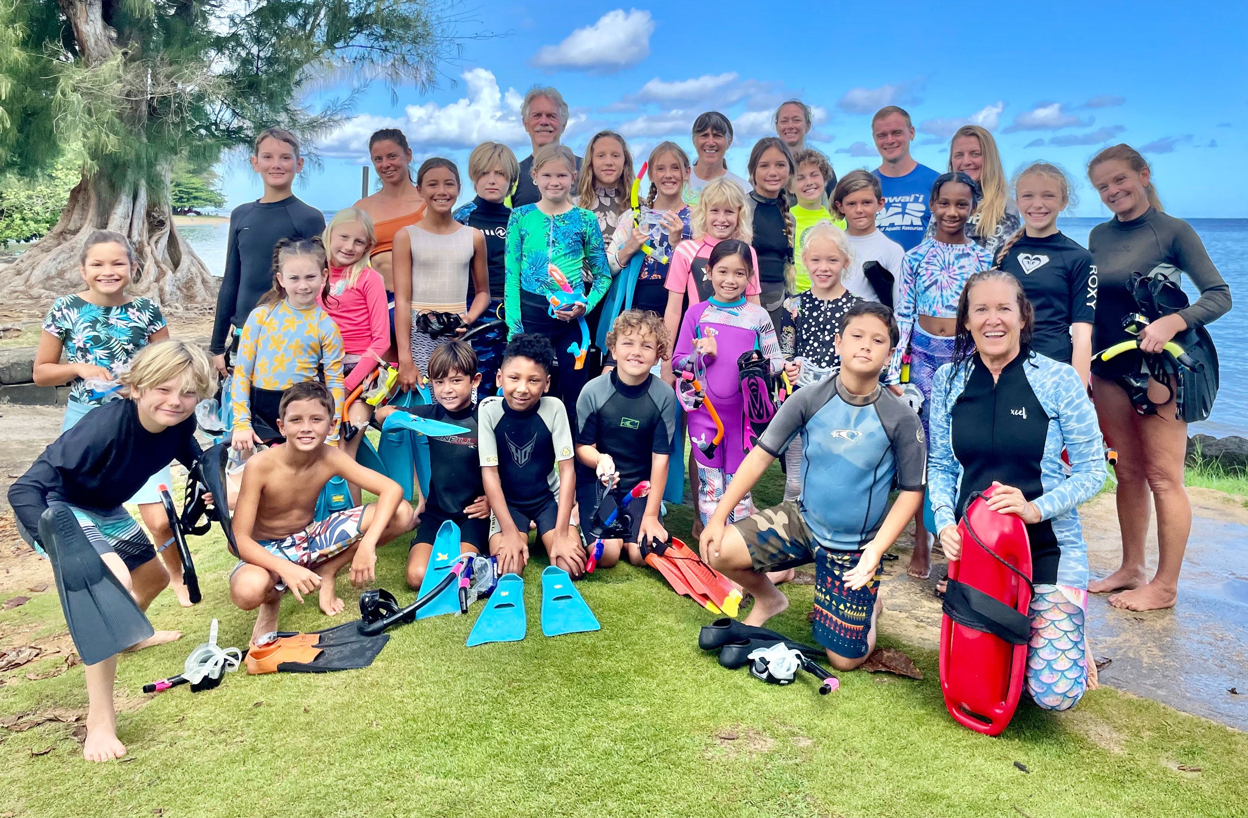 The Reef Guardians coral reef health nonprofit based in Kauai, Hawaii with its Sea School education program participants.