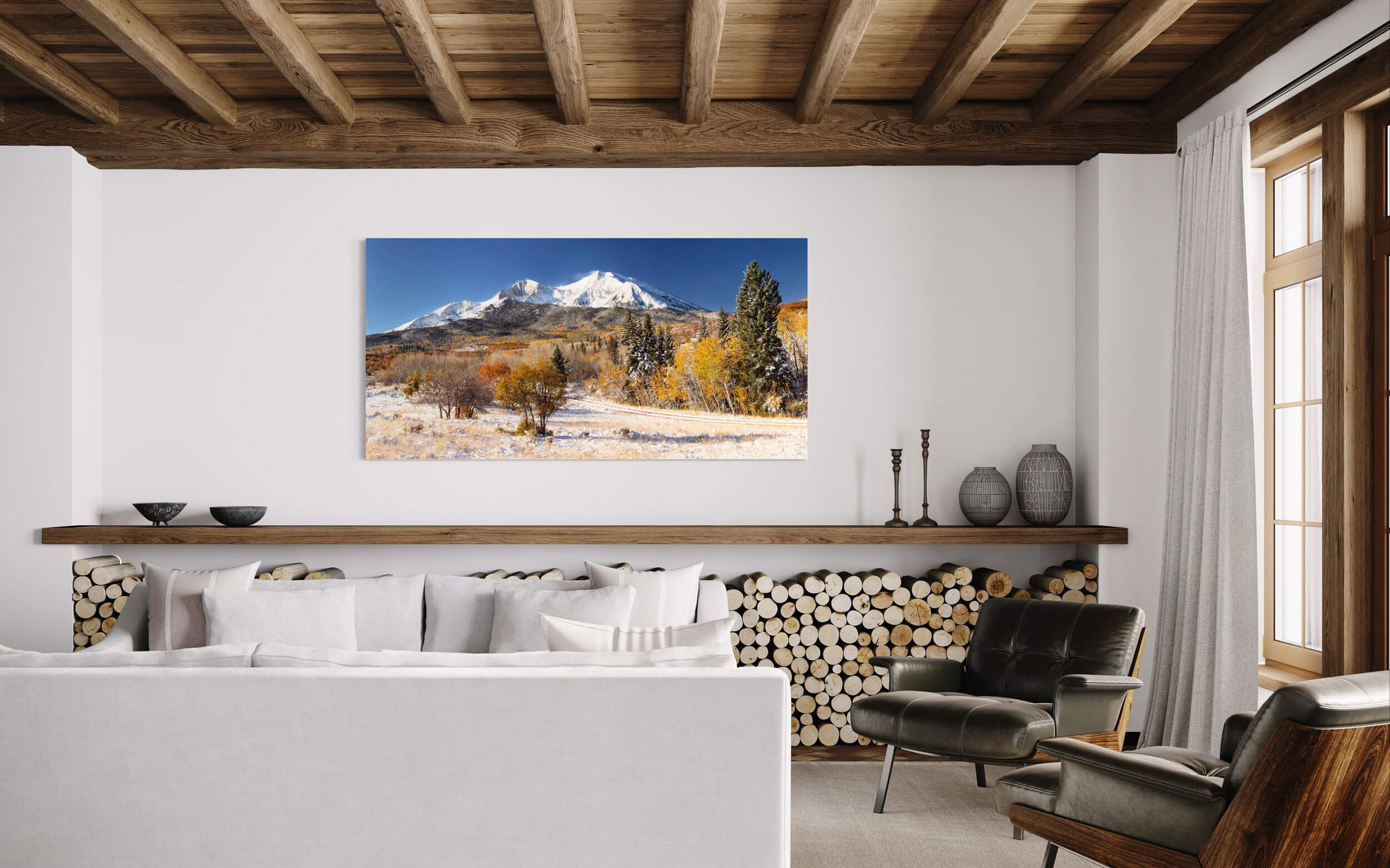 A Mount Sopris picture hangs in a living room.