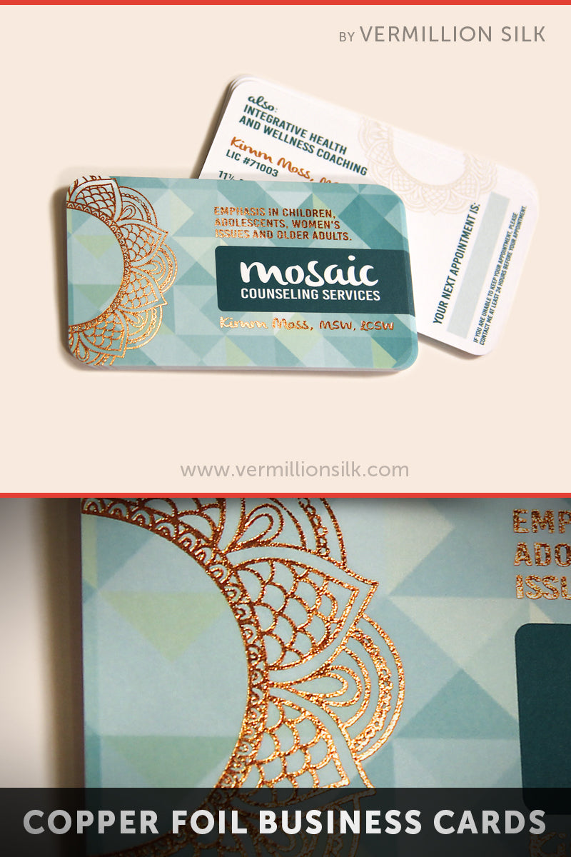 Teal rounded business cards with intricate copper foil stamp pattern