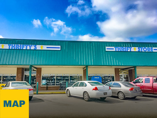 Exterior photograph of PRIME THRIFT Wilmington with blue sky and cars in the parking lot