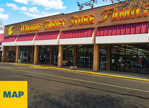 Exterior photograph of PRIME THRIFT Waldorf with partly cloudy blue sky