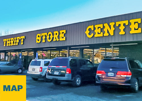 Exterior photograph of PRIME THRIFT Alexandria, VA with blue sky and cars parked in front