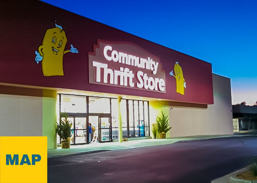 Exterior photograph of PRIME THRIFT Tulsa at twilight with blue sky