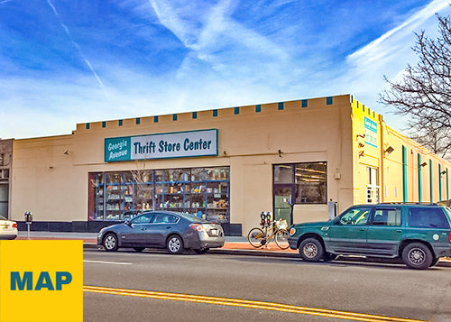 Exterior photograph of PRIME THRIFT Washington, D.C. with blue sky and ars