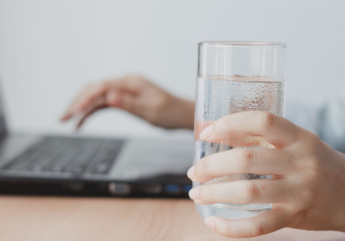 holding a glass of water