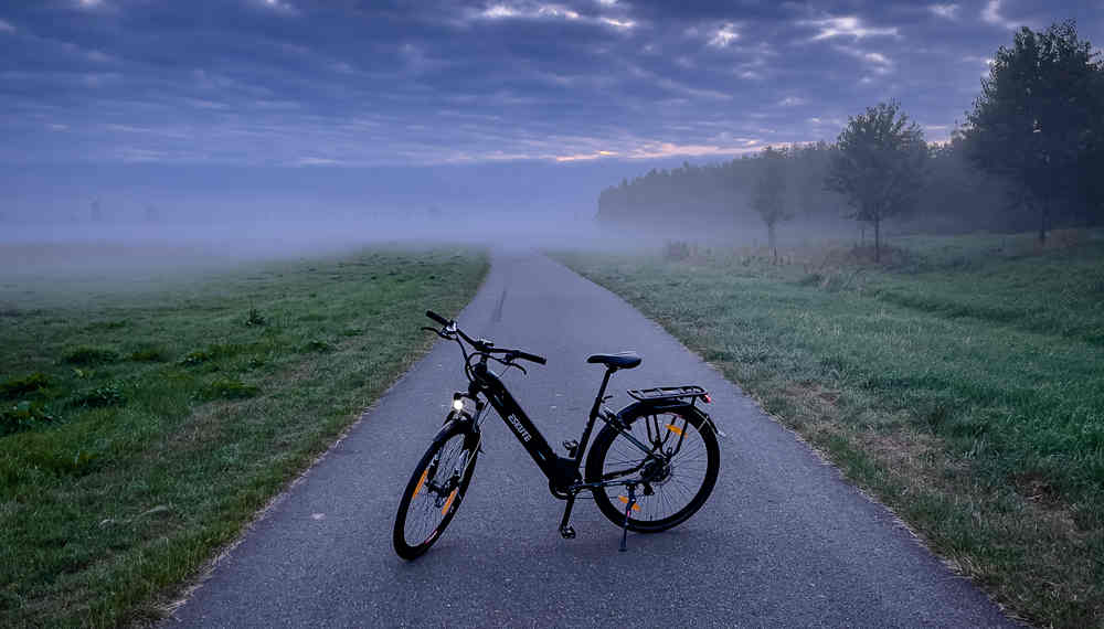 Eskute electric hybrid bike on the road
