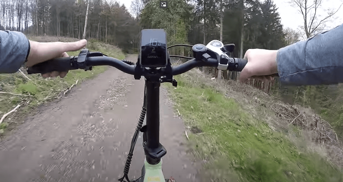 Looking at the screen and riding a folding electric bicycle