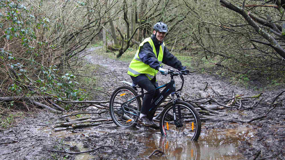 a man gets his electric bike stuck in the muddy