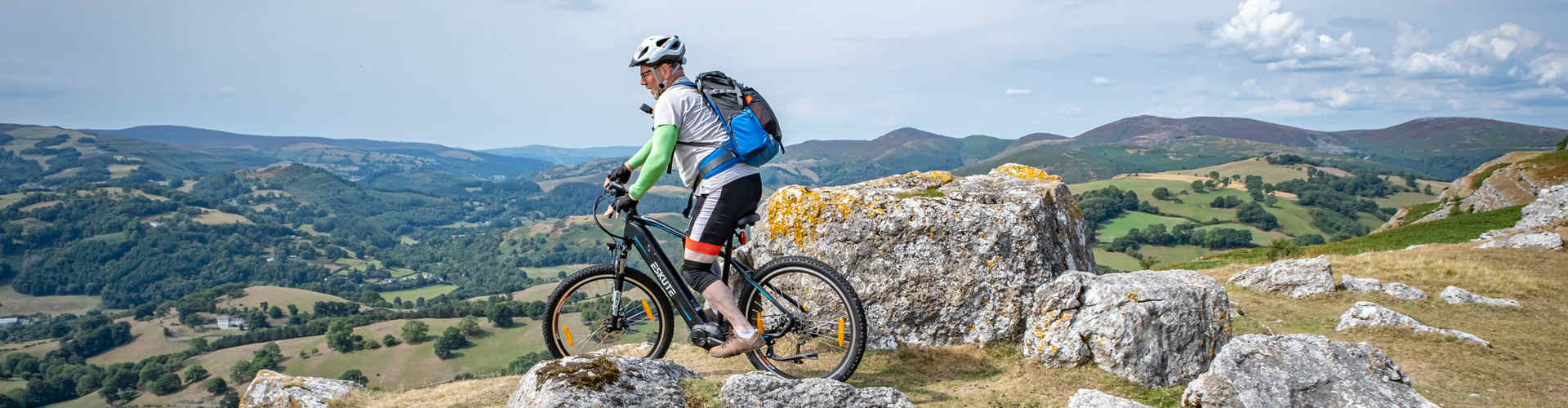 a man rides the electric Bikes under £2000 at the mountain top