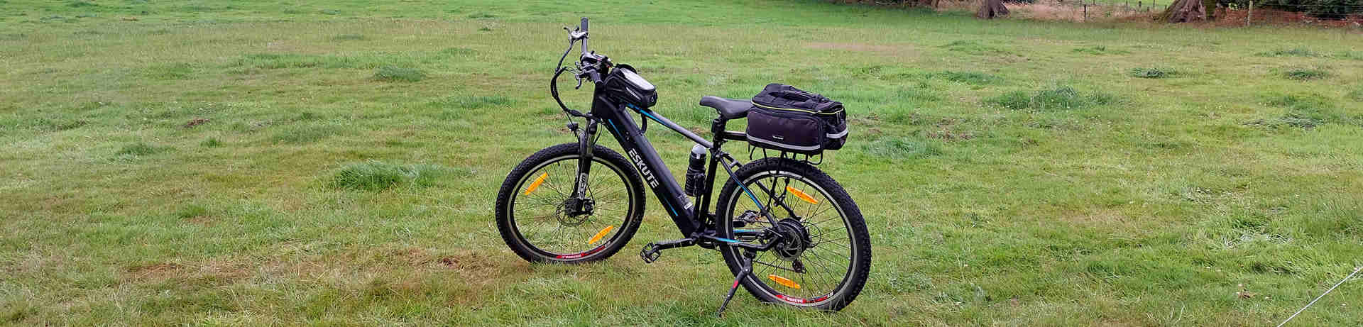 electric mountain bike on the grasslands is equipped with lots of accessories