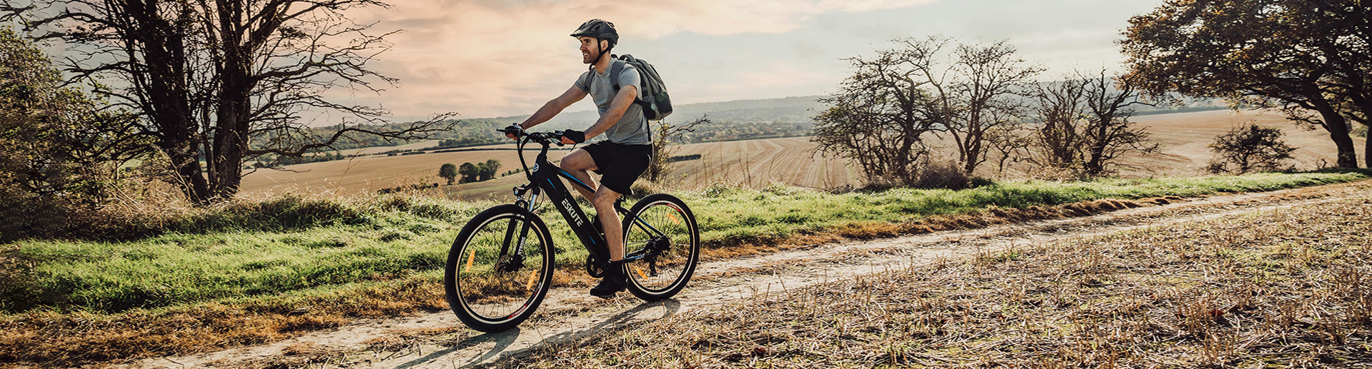 A man is riding an electric bike in the wild or countryside