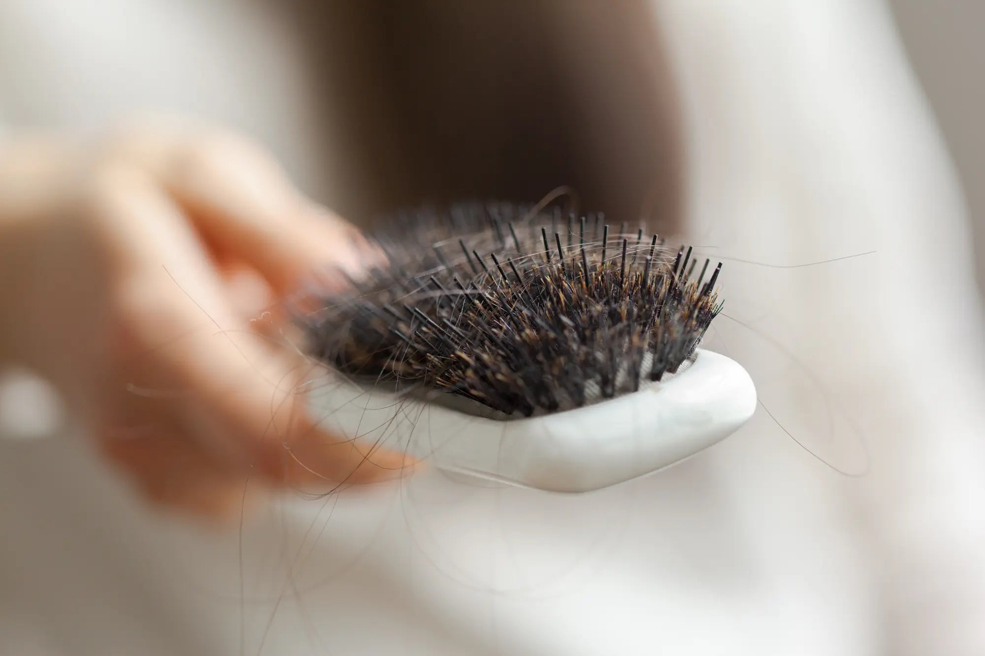 what causes postpartum hair loss