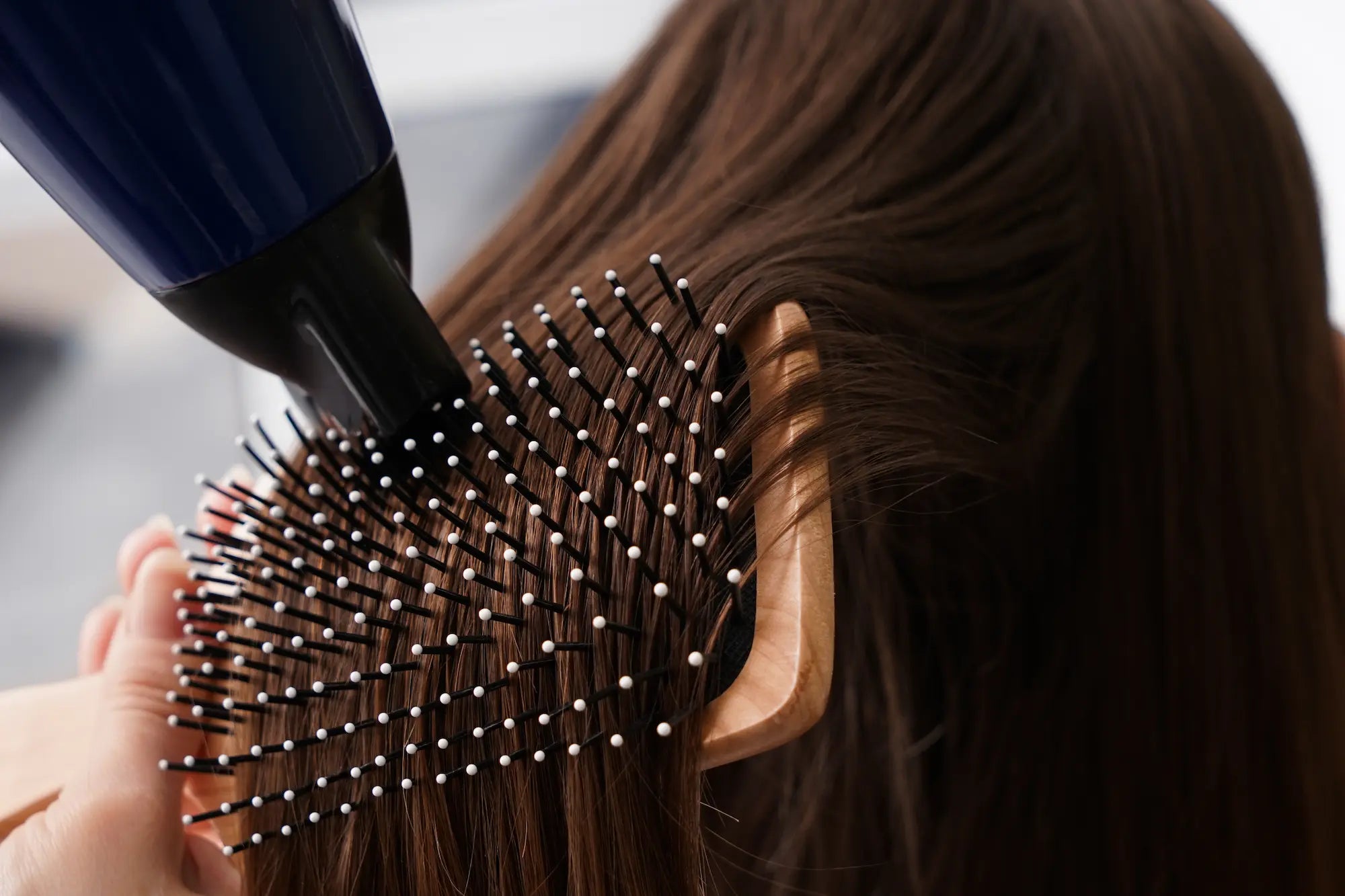 woman drying her hair