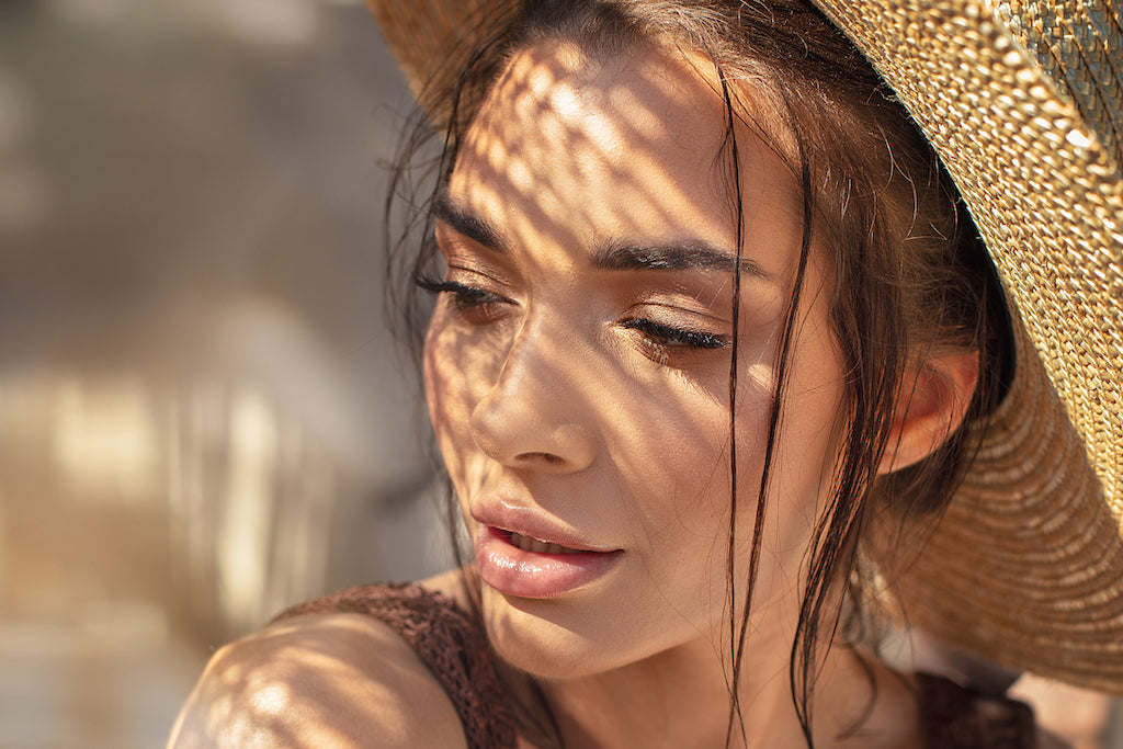 woman wearing straw wide brim hat