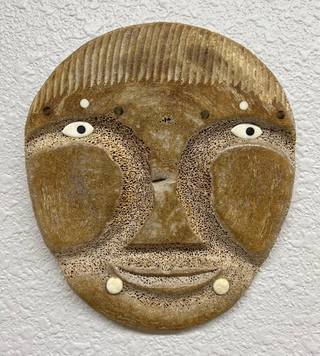 Lot - INUPIAQ ESKIMO FOSSILIZED WHALE BONE MASK, LATE 20TH CENTURY Height:  5 in. (12.70 cm.)