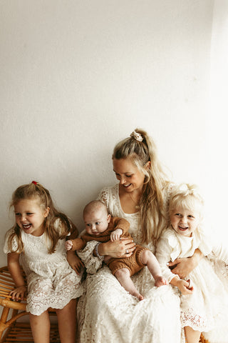 mother with three children looking happy