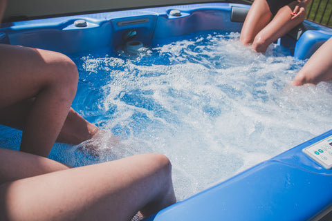 friends enjoying the hot tub during winter