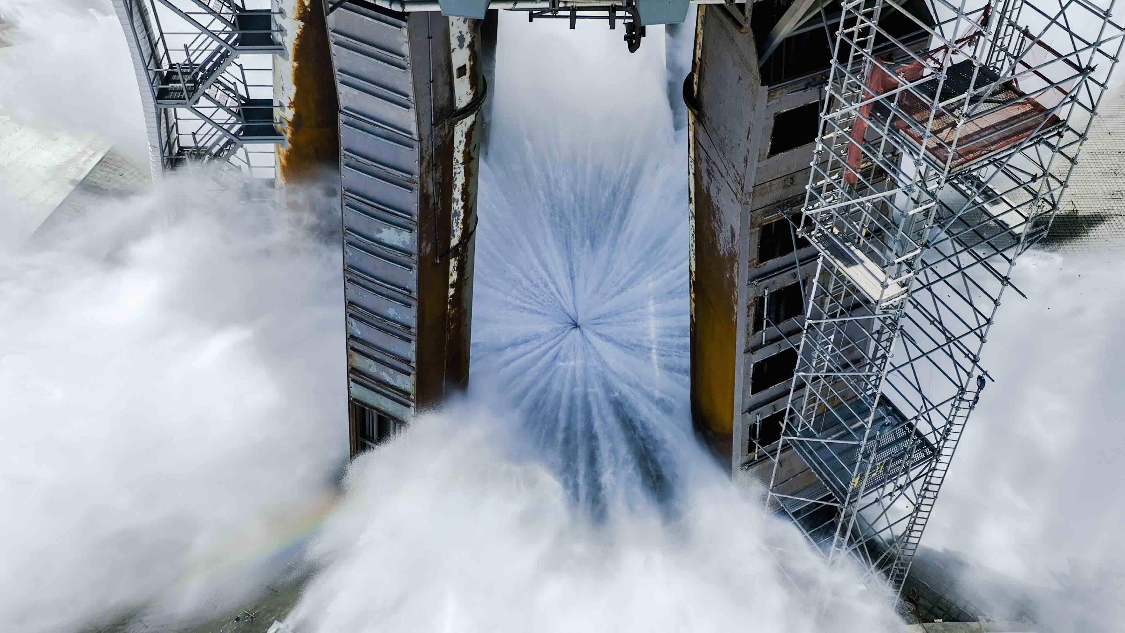 A top-down view of the first Water Deluge Test from the SpaceX Launch Tower in Starbase Texas.