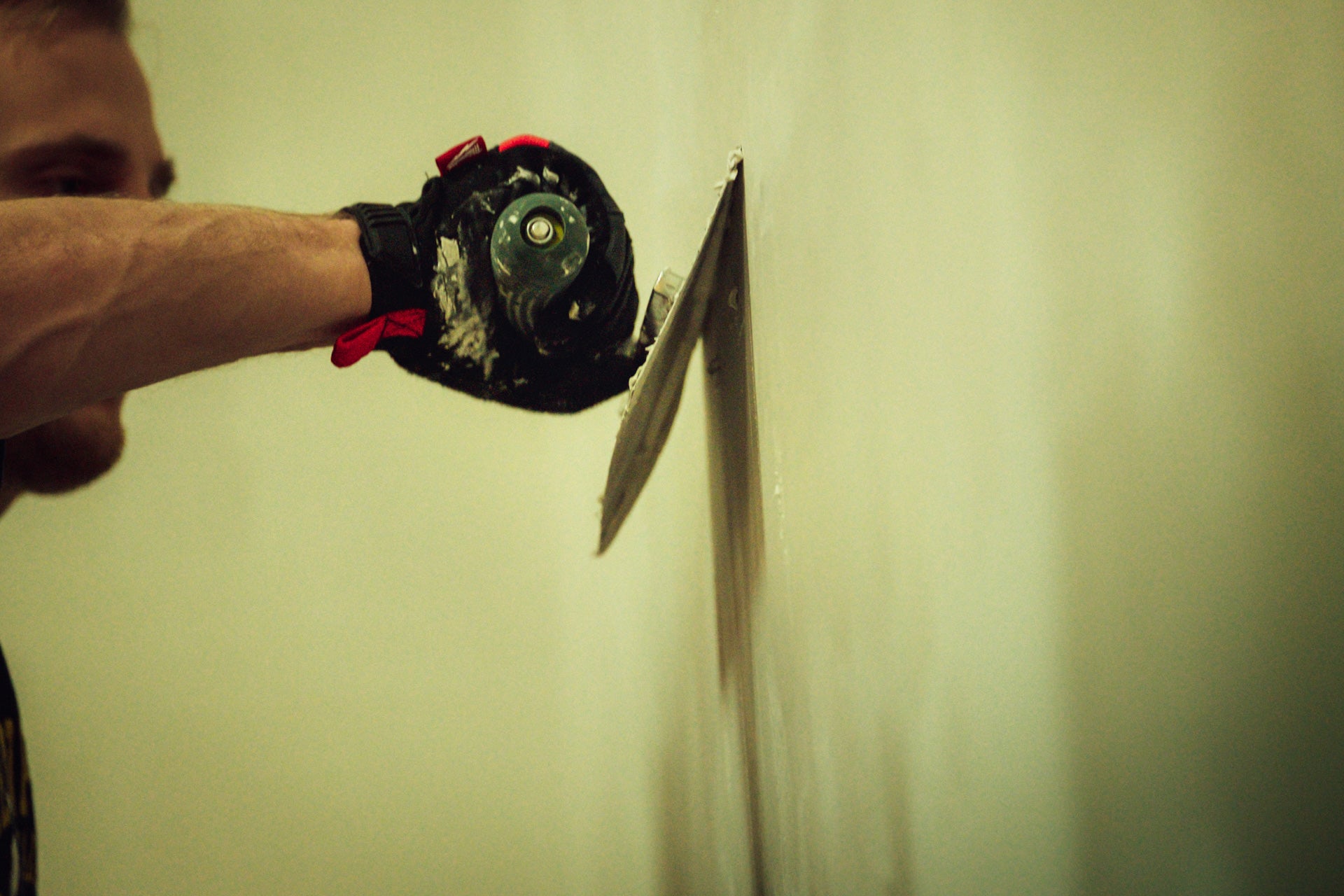 Kyle putting some finishing touches on the drywall.