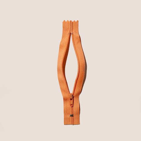 A zipper meant to convey female anatomy