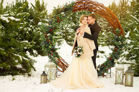 Winter wedding couples in the snow