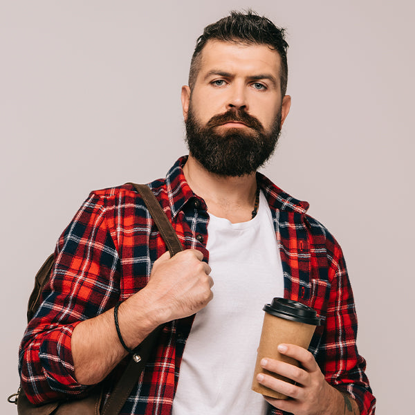 A man with a full beard sporting a casual look