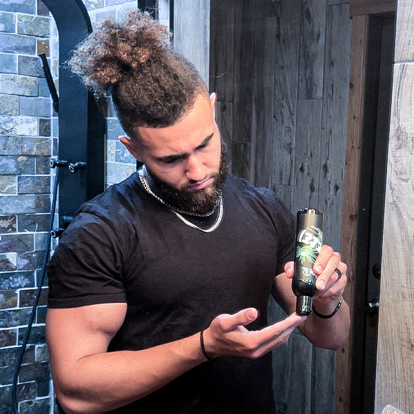 A man pouring a bottle of beard shampoo