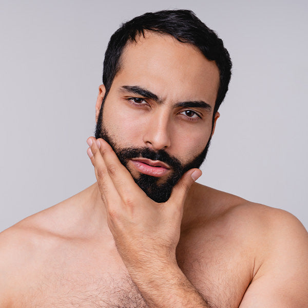 A man stroking his soft and silky beard