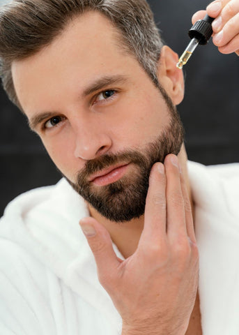 man applying beard oil everyday for beard growth