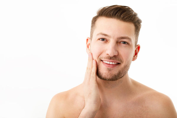 man applying beard butter to his beard