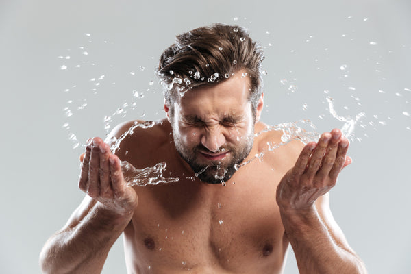 bearded white man washing his face and beard properly