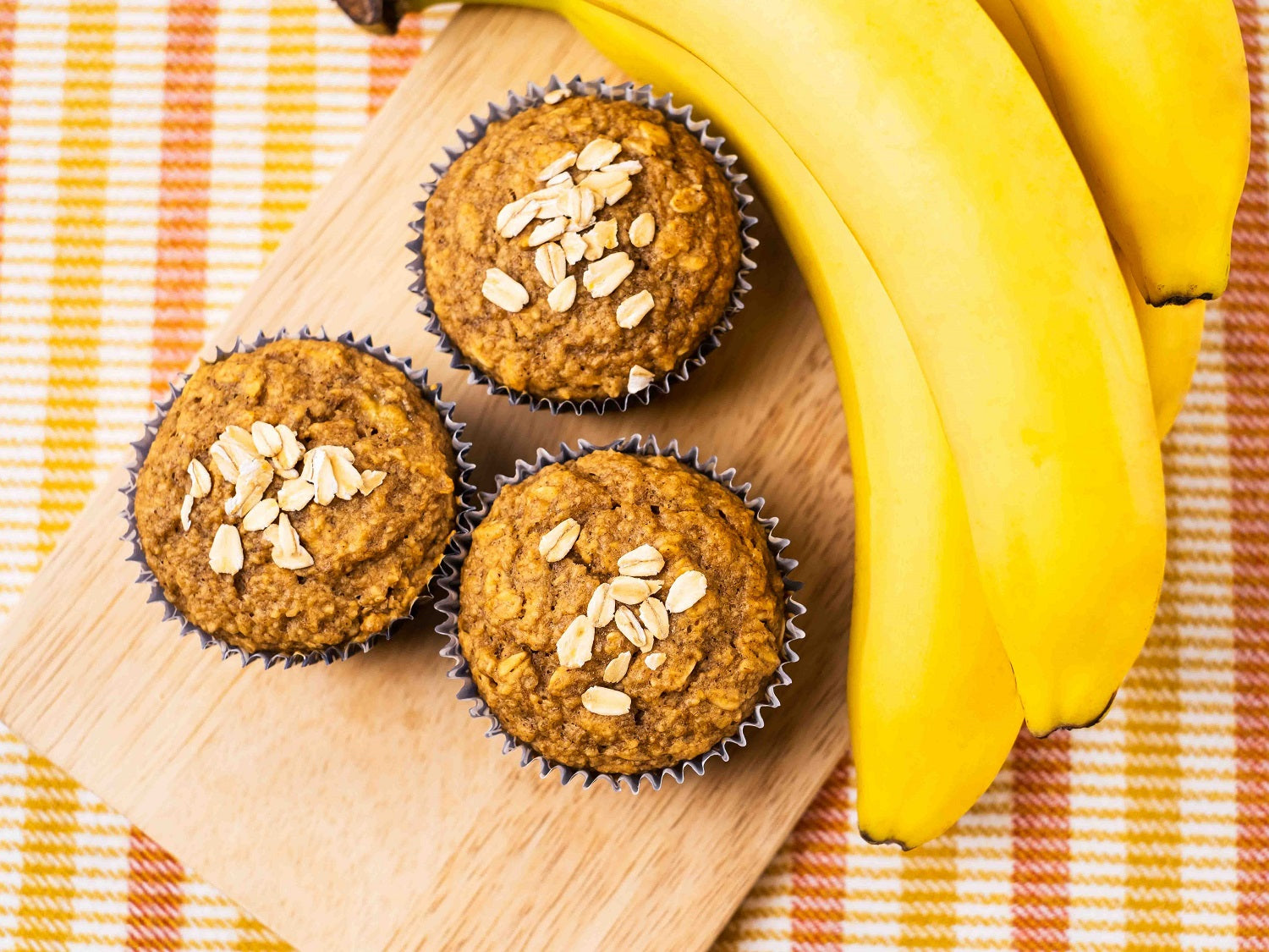 Banana Oat Muffins on a wooden board