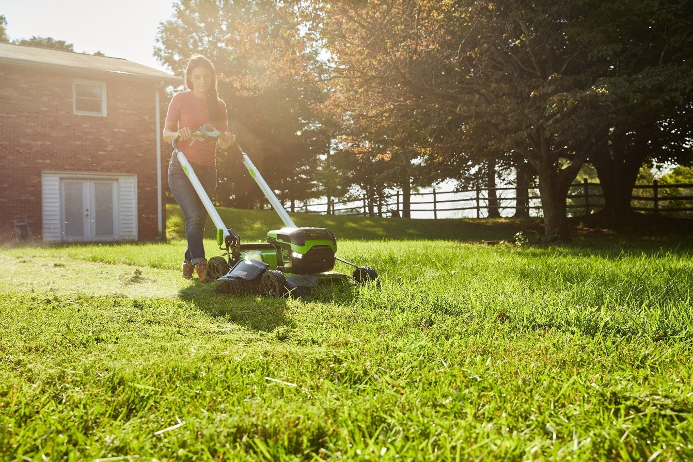 woman-mowing-lawn-with-greenworks-lawn-mower