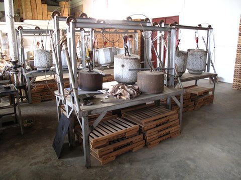 Heavier stone presses on a pulley system