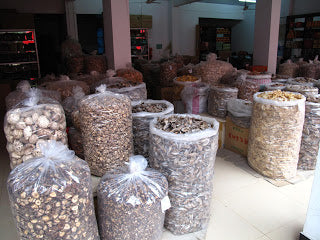Sacks of wild forest mushrooms for sale