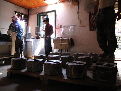 Stone presses used in Zhen Si Long's puer manufacture