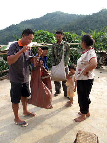 Weighing the day's tea harvest