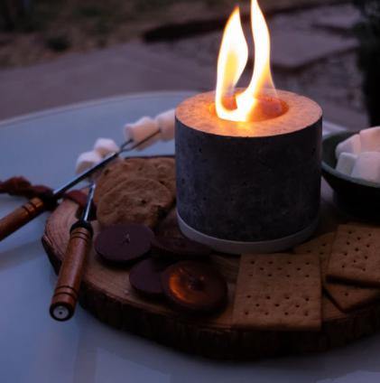 indoor fire pot with marshmallows, chocolate, and graham crackers to make s'mores