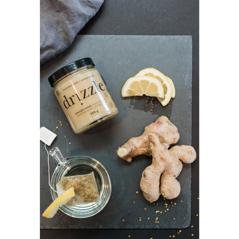 drizzle honey jar with lemon slices and ginger