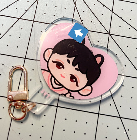 mini heart uchiwa charm with protective film being peeled off from the top left corner
