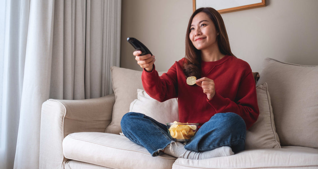 teen watching tv at home