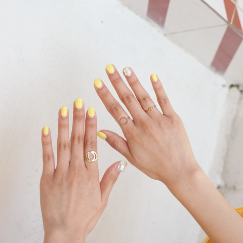 Image of brightly coloured painted finger nails