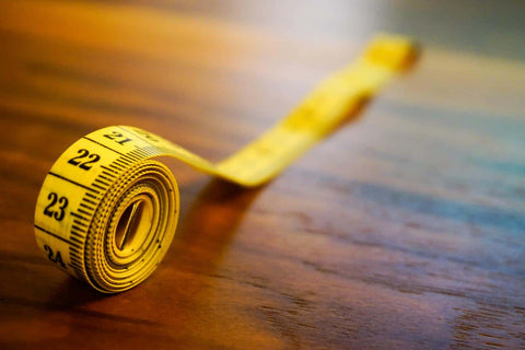 A rolled measuring tape in close up view