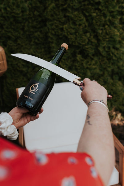 knife to saber a bottle of Oh! Bubbly White Wine