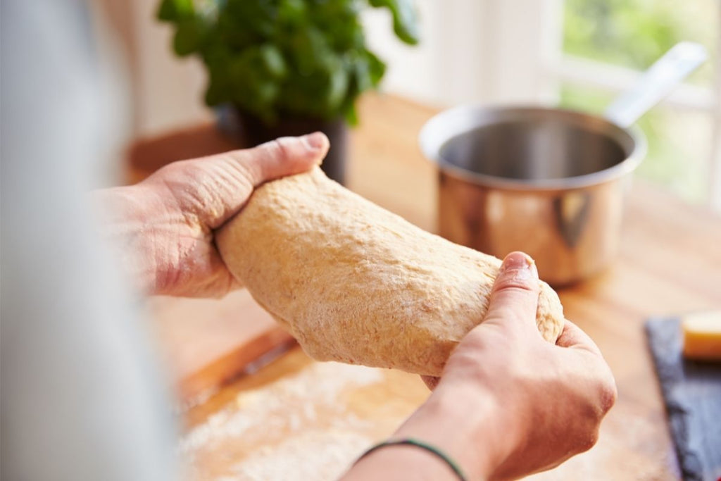 kneading sourdough pizza dough